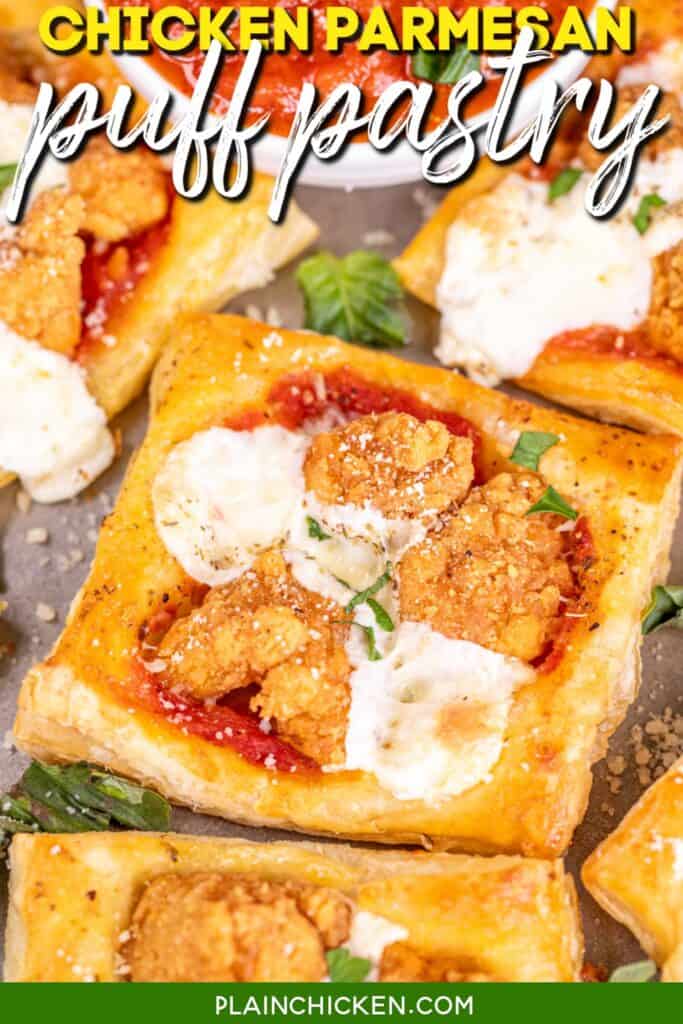 chicken parmesan puff pastry bites on a baking tray with pizza sauce with text overlay