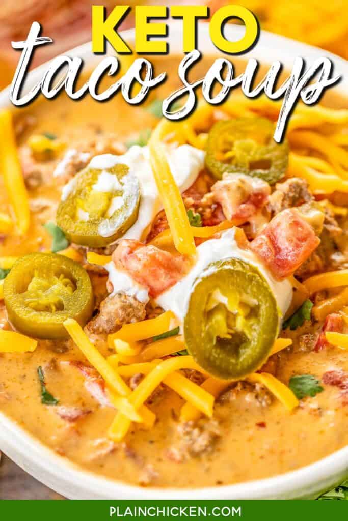 bowl of keto taco soup topped with cheese, sour cream, and jalapenos with text overlay