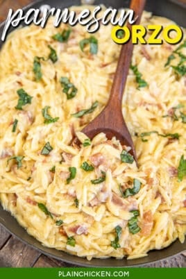 scooping creamy orzo with prosciutto and basil from skillet with text overlay