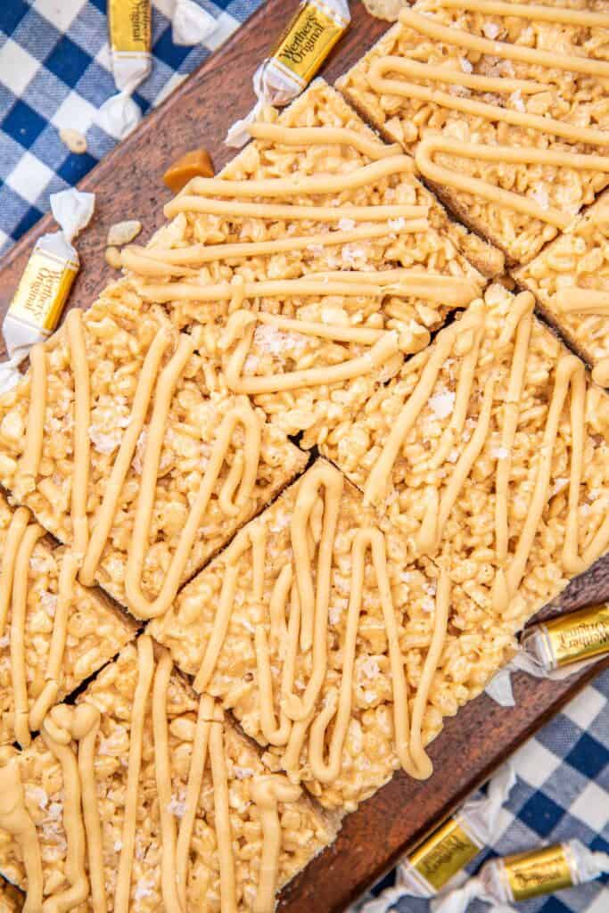 salted caramel rice krispie treats on a board with text overlay