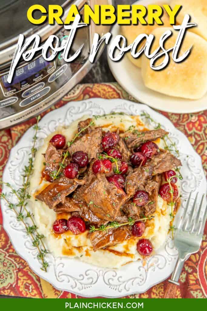 plate of cranberry pot roast over mashed potatoes on a table with text overlay