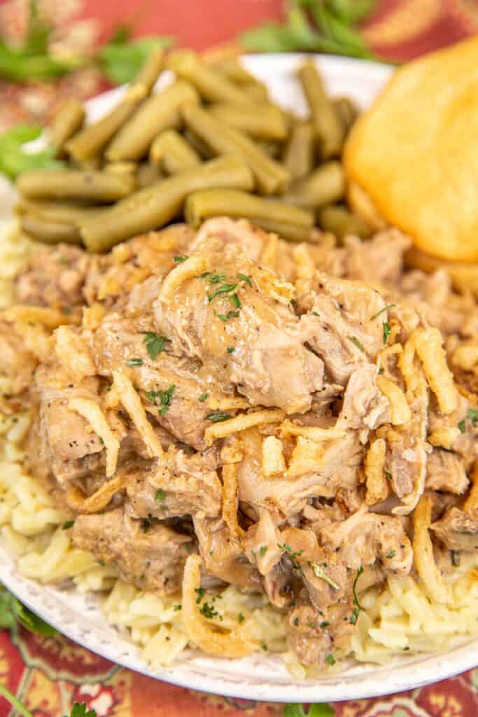 plate of shredded pork tenderloin with green beans and biscuits