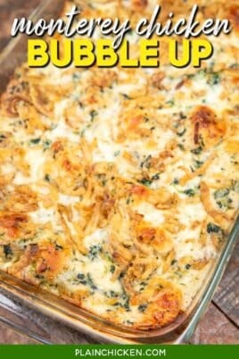 baking dish of chicken spinach and biscuit casserole topped with cheese and fried onions with text overlay