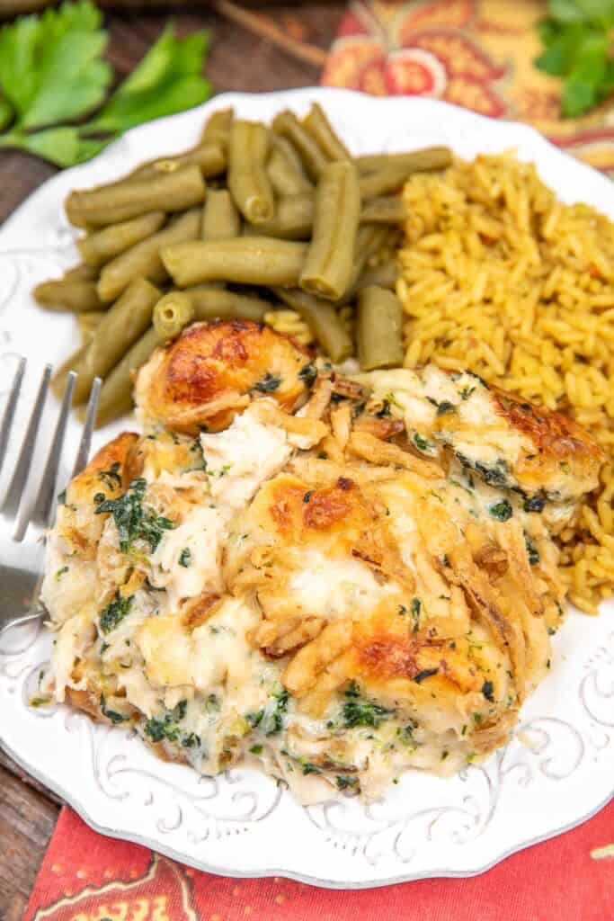 plate of chicken spinach and biscuit casserole with rice and green beans
