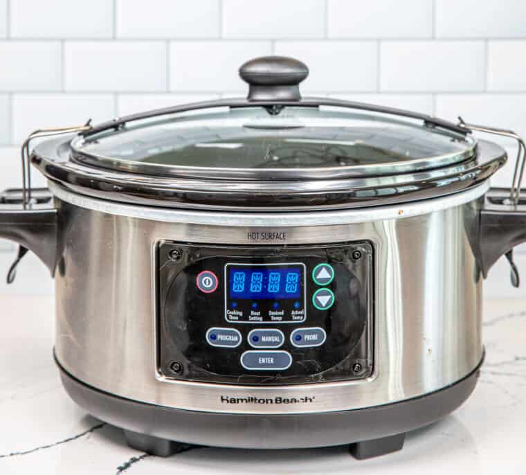 slow cooker on a countertop in the kitchen