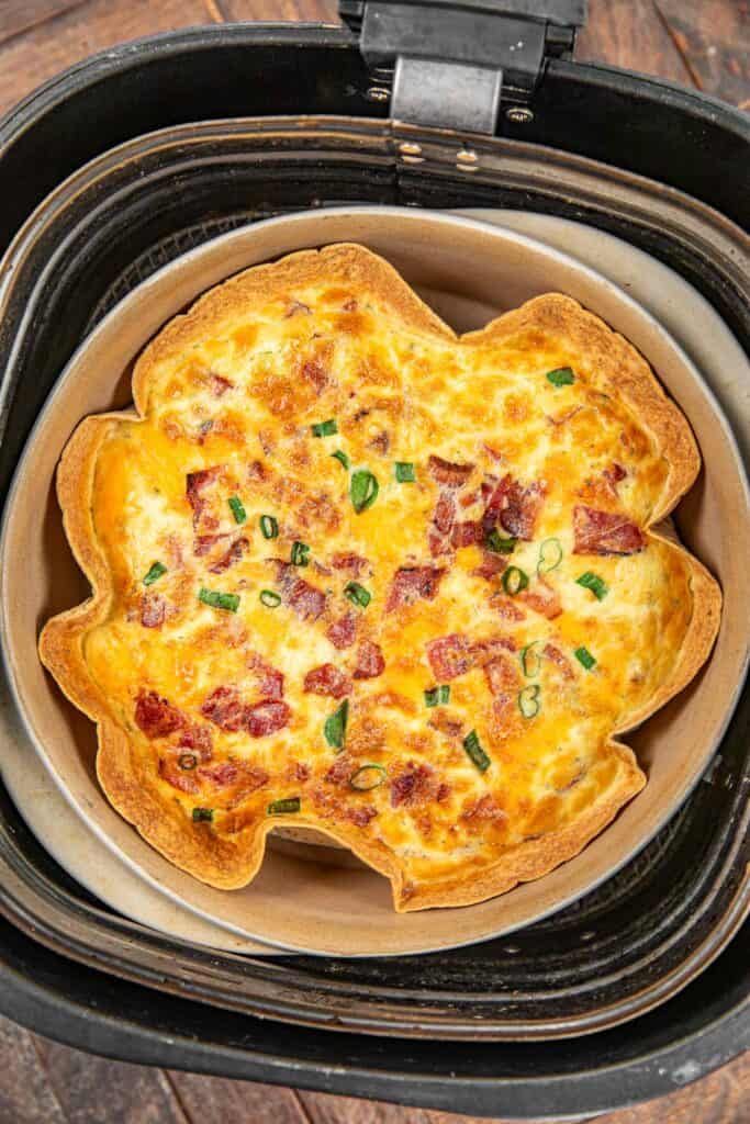 bacon quiche with tortilla crust in an air fryer basket