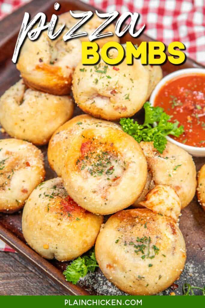 baking tray of pizza bombs with pizza sauce with text overlay