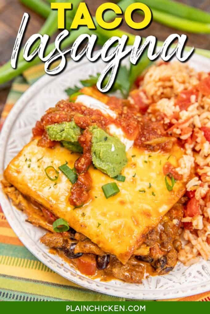 slice of taco lasagna topped with salsa, guacamole, and sour cream on a plate with mexican rice with text overlay
