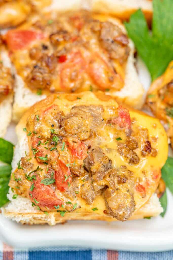 rotel sausage and cheese toasts on a platter