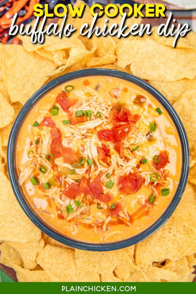 bowl of buffalo chicken cheese dip surrounded by tortilla chips with text overlay