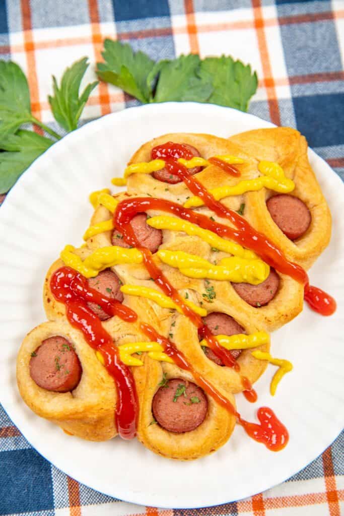 twisted crescent roll hot dog on a plate