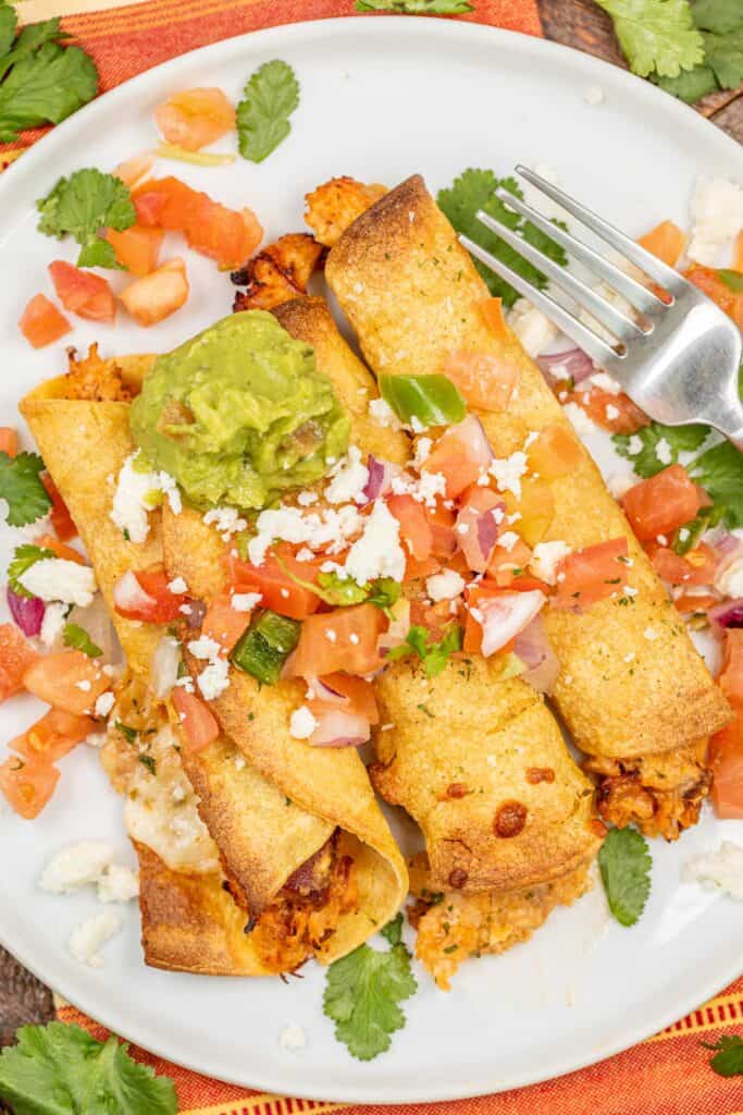 plate of chicken taquitos