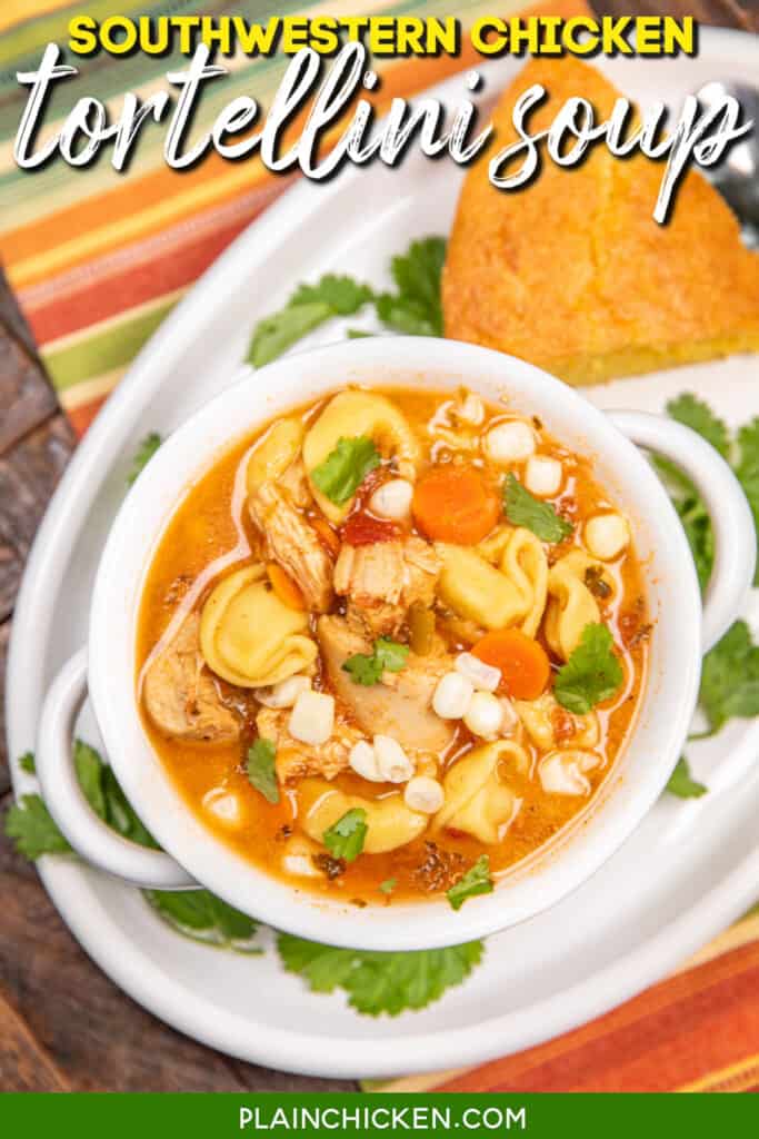 bowl of chicken and tortellini soup on a table with cornbread and parsley with text overlay